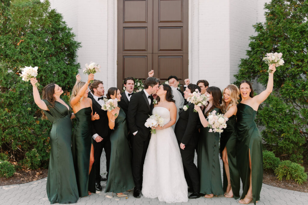 Simple and elegant all-white bridesmaid bouquets with hints of blush and pink for Belle Meade wedding in Nashville. Florals highlighted are dahlias, garden roses, majolika roses, ranunculus, butterfly ranunculus, clematis, sweet peas, astilbe, scabiosa, pieris, saponaria and minimal greenery. The white phalaenopsis creates a soft and bright focal moment for the bouquet. Design by Rosemary and Finch Floral Design in Nashville, TN. 