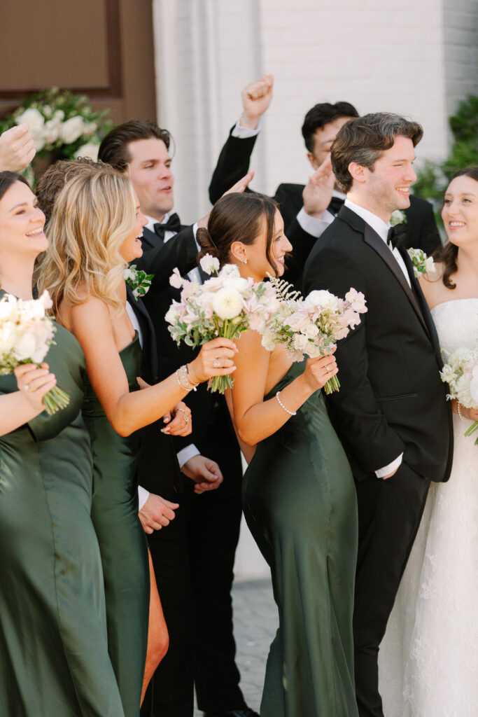 Simple and elegant all-white bridesmaid bouquets with hints of blush and pink for Belle Meade wedding in Nashville. Florals highlighted are dahlias, garden roses, majolika roses, ranunculus, butterfly ranunculus, clematis, sweet peas, astilbe, scabiosa, pieris, saponaria and minimal greenery. The white phalaenopsis creates a soft and bright focal moment for the bouquet. Design by Rosemary and Finch Floral Design in Nashville, TN. 