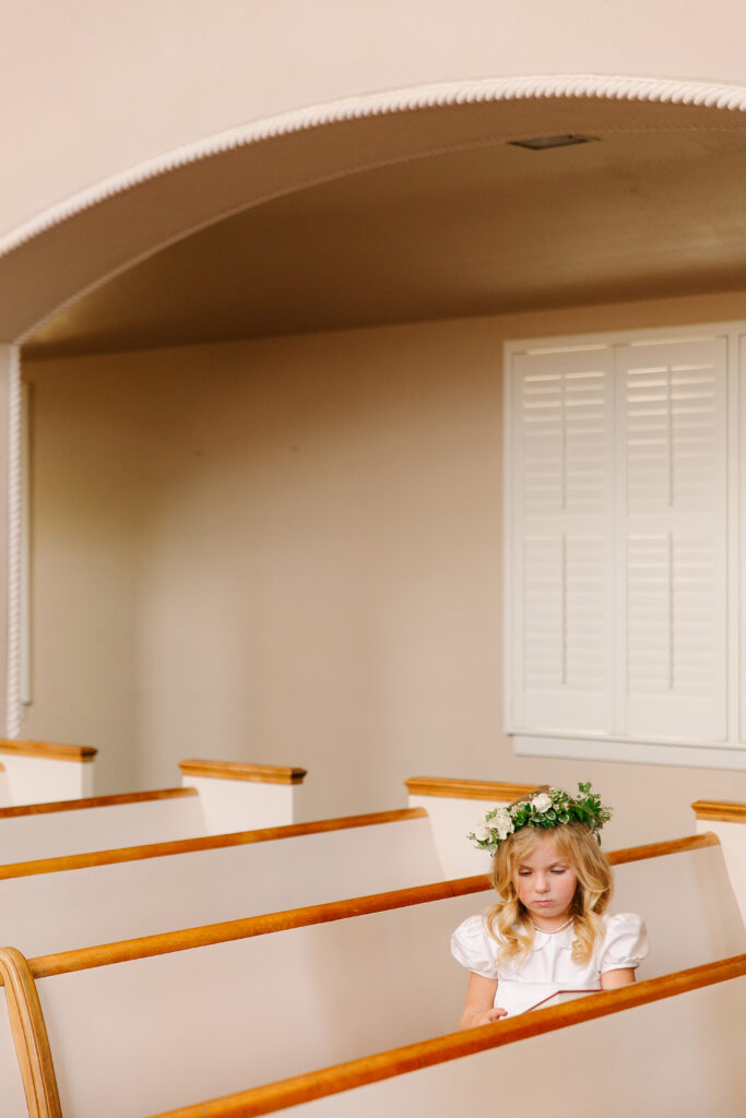 Stunning, elegant flower-forward all-white bridal bouquet with hints of blush and pink for Belle Meade wedding in Nashville. Florals highlighted are phalaenopsis, dahlias, garden roses, majolika roses, ranunculus, butterfly ranunculus, clematis, sweet peas, astilbe, scabiosa and light greenery. The white phalaenopsis creates a soft and bright focal moment for the bouquet. Design by Rosemary and Finch Floral Design in Nashville, TN. 