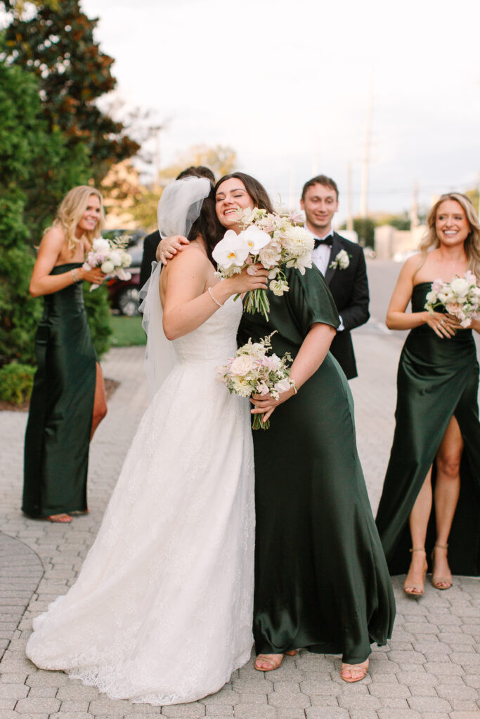 Stunning, elegant flower-forward all-white bridal bouquet with hints of blush and pink for Belle Meade wedding in Nashville. Florals highlighted are phalaenopsis, dahlias, garden roses, majolika roses, ranunculus, butterfly ranunculus, clematis, sweet peas, astilbe, scabiosa and light greenery. The white phalaenopsis creates a soft and bright focal moment for the bouquet. Design by Rosemary and Finch Floral Design in Nashville, TN. 
