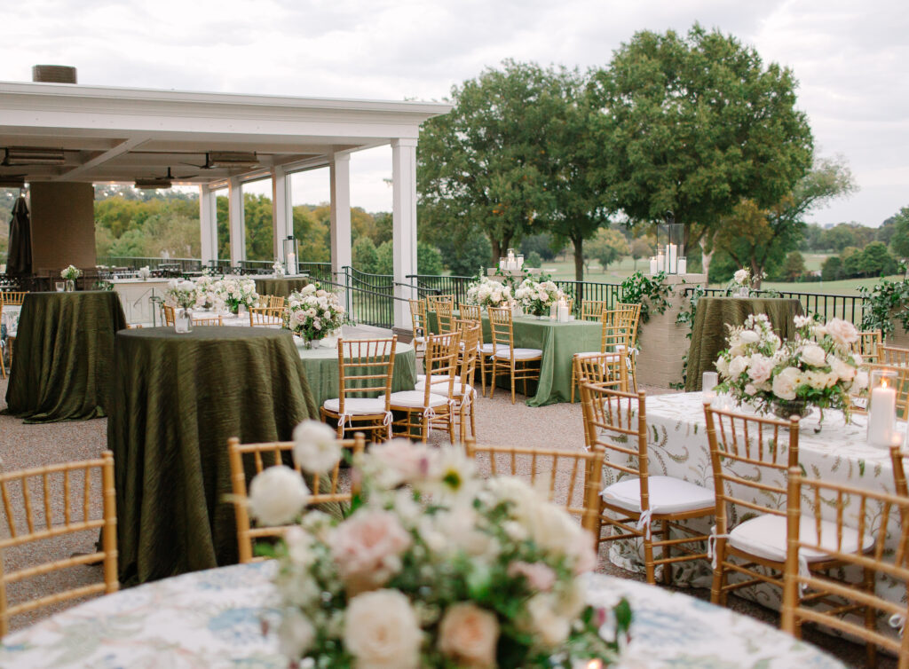 Lush and elegant floral centerpieces for Nashville wedding at Hillwood Country Club. Light pinks, blush and white florals consist of dahlias, garden roses, playa blancas, quicksand roses, ranunculus, lisianthus, majolikas, pieris, delphinium, sweet peas, saponaria, clematis, astilbe, and contrasting greenery. Centerpieces were accompanied by warm candlelight and lush vines growing near the bar for a beautiful wedding reception. Design by Rosemary and Finch Floral Design in Nashville, TN. 