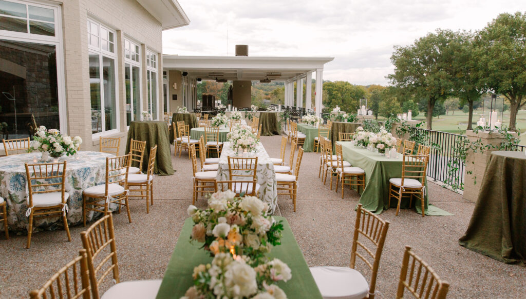 Lush and elegant floral centerpieces for Nashville wedding at Hillwood Country Club. Light pinks, blush and white florals consist of dahlias, garden roses, playa blancas, quicksand roses, ranunculus, lisianthus, majolikas, pieris, delphinium, sweet peas, saponaria, clematis, astilbe, and contrasting greenery. Centerpieces were accompanied by warm candlelight and lush vines growing near the bar for a beautiful wedding reception. Design by Rosemary and Finch Floral Design in Nashville, TN. 
