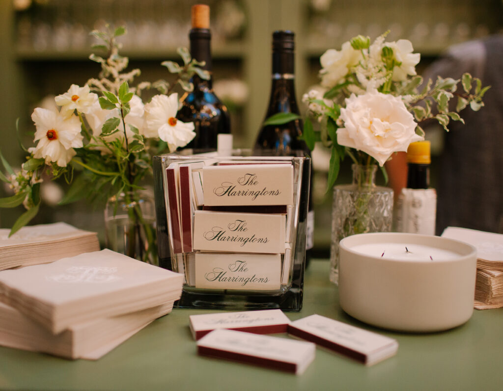 Simple, bright bud vases scattered throughout the room for a gorgeous wedding reception at Hillwood Country Club in Nashville. Bud vase florals highlighted dahlias, quicksand roses, astilbe, pieris, lisianthus, ranunculus, butterfly ranunculus, sweet peas, clematis, delphinium, saponaria and light greenery to reflect an elegant atmosphere. Design by Rosemary and Finch Floral Design in Nashville, TN.