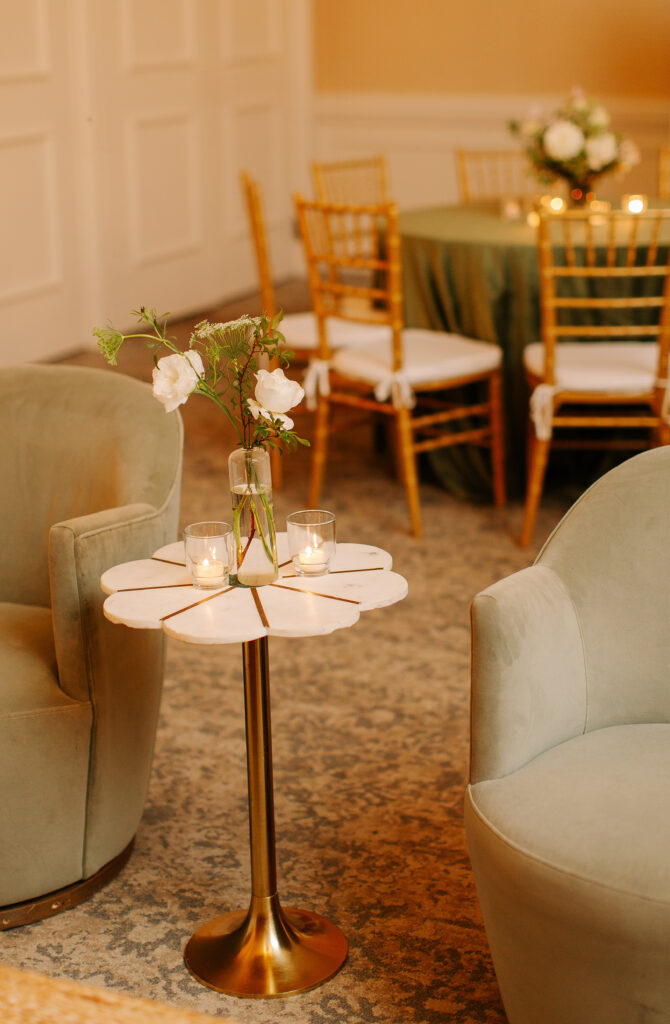 Simple, bright bud vases scattered throughout the room for a gorgeous wedding reception at Hillwood Country Club in Nashville. Bud vase florals highlighted dahlias, quicksand roses, astilbe, pieris, lisianthus, ranunculus, butterfly ranunculus, sweet peas, clematis, delphinium, saponaria and light greenery to reflect an elegant atmosphere. Design by Rosemary and Finch Floral Design in Nashville, TN.