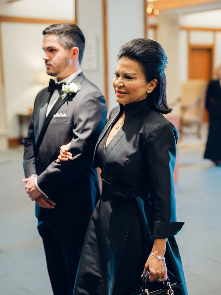 Romantic, editorial bridal bouquet featuring all-white garden roses, cloud roses, sweet peas, spray roses, ranunculus, and lisianthus accompanied by olive branches and light greenery. Soft and romantic bouquet to highlight elegance of a botanical tented wedding at Cheekwood. Design by Rosemary & Finch Floral Design in Nashville, TN.