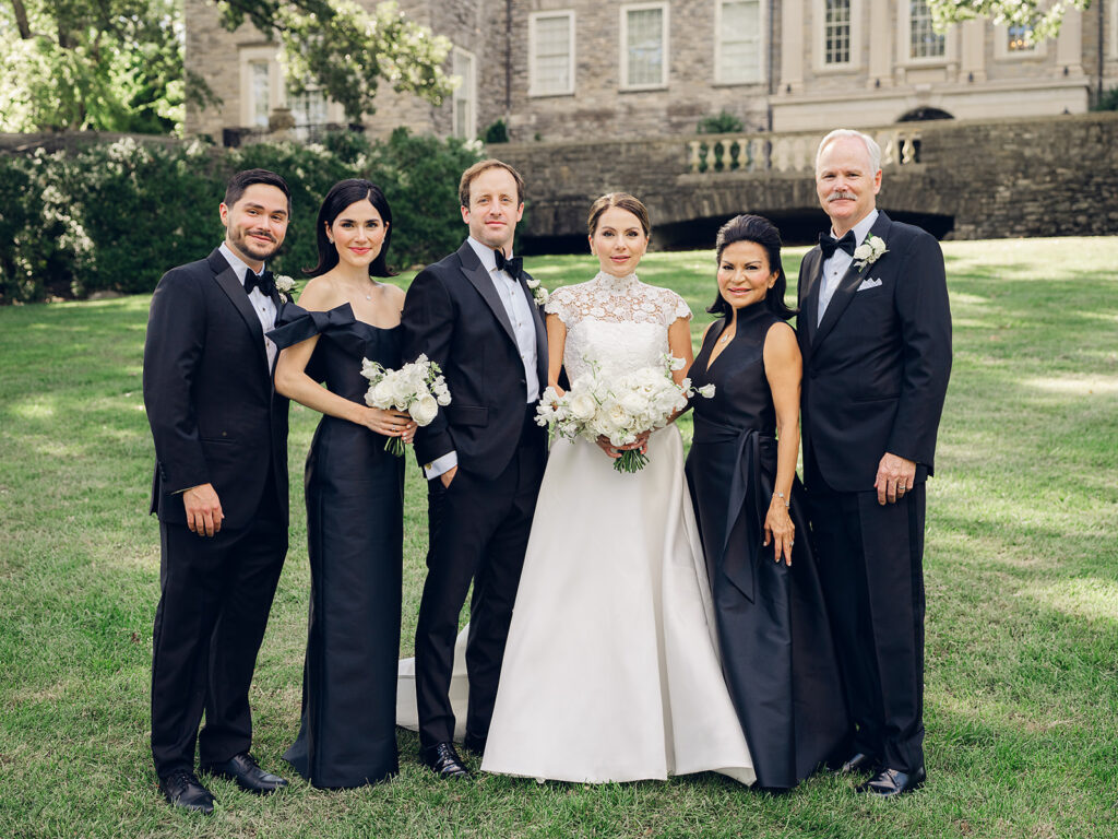 Romantic, editorial bridal bouquet featuring all-white garden roses, cloud roses, sweet peas, spray roses, ranunculus, and lisianthus accompanied by olive branches and light greenery. Soft and romantic bouquet to highlight elegance of a botanical tented wedding at Cheekwood. Design by Rosemary & Finch Floral Design in Nashville, TN.