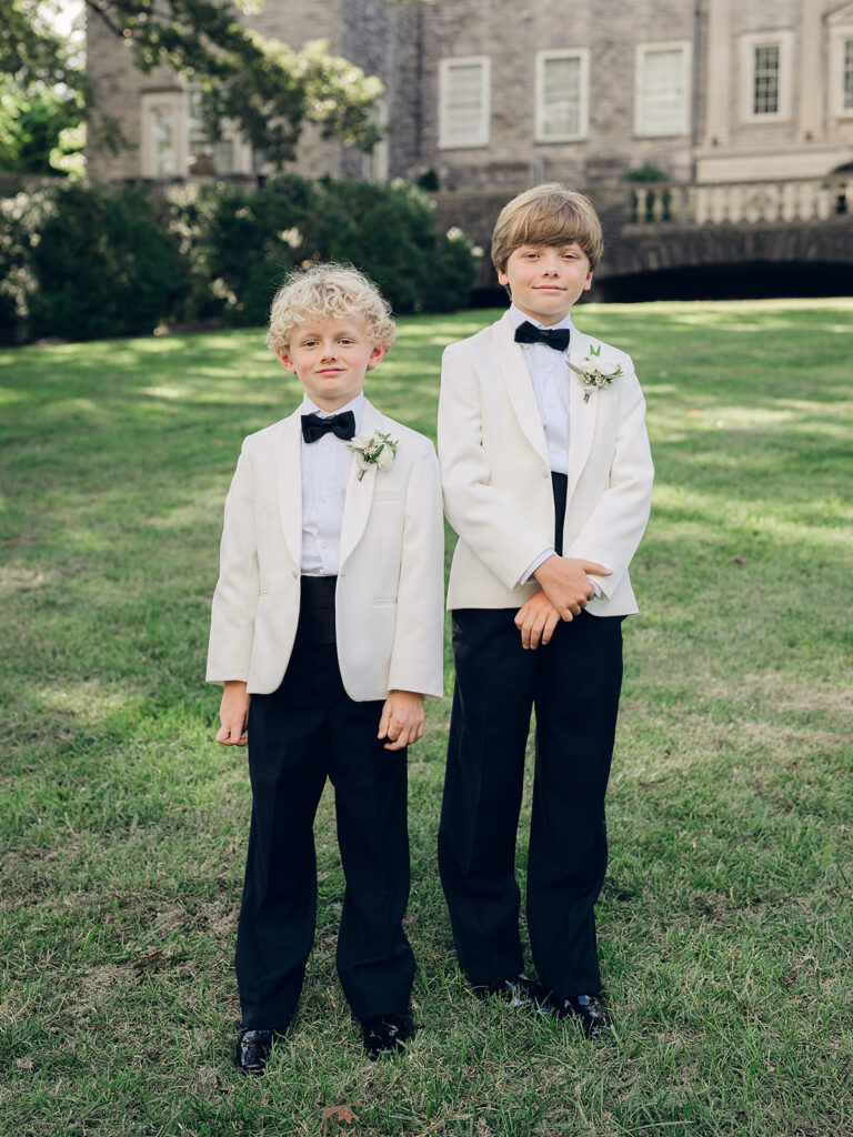 Romantic, editorial bridal bouquet featuring all-white garden roses, cloud roses, sweet peas, spray roses, ranunculus, and lisianthus accompanied by olive branches and light greenery. Soft and romantic bouquet to highlight elegance of a botanical tented wedding at Cheekwood. Design by Rosemary & Finch Floral Design in Nashville, TN.
