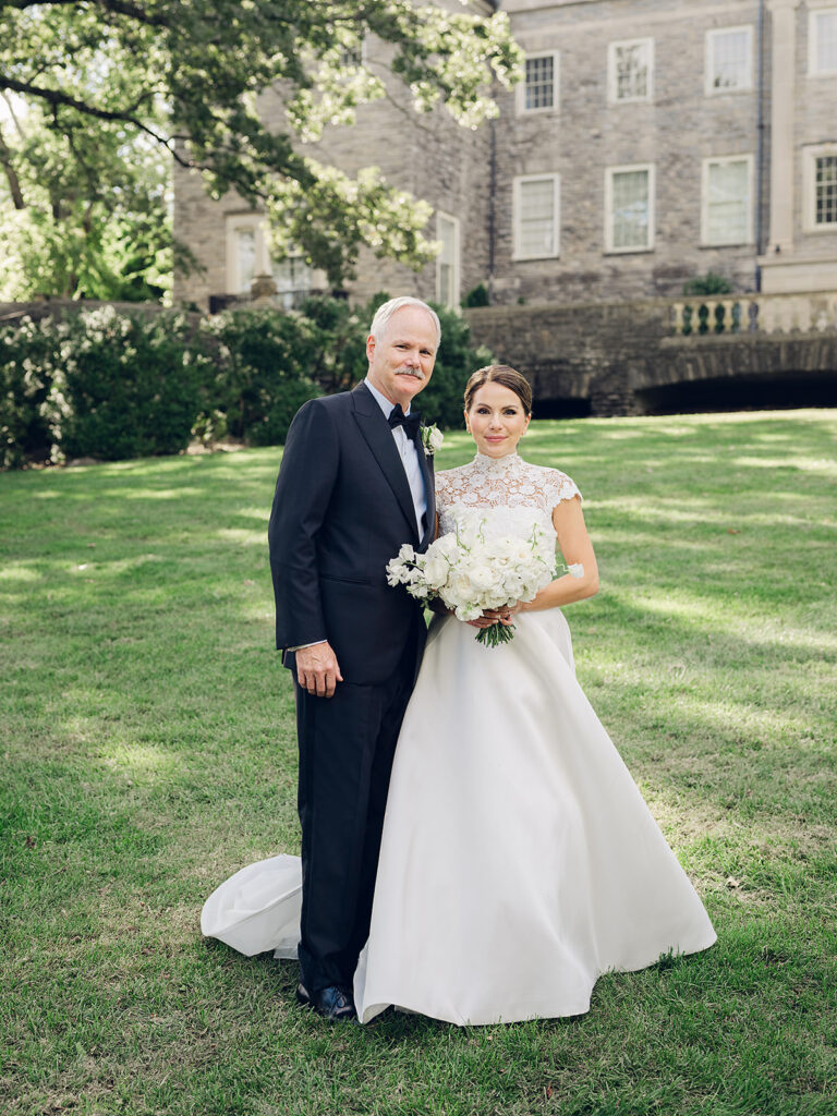 Romantic, editorial bridal bouquet featuring all-white garden roses, cloud roses, sweet peas, spray roses, ranunculus, and lisianthus accompanied by olive branches and light greenery. Soft and romantic bouquet to highlight elegance of a botanical tented wedding at Cheekwood. Design by Rosemary & Finch Floral Design in Nashville, TN.