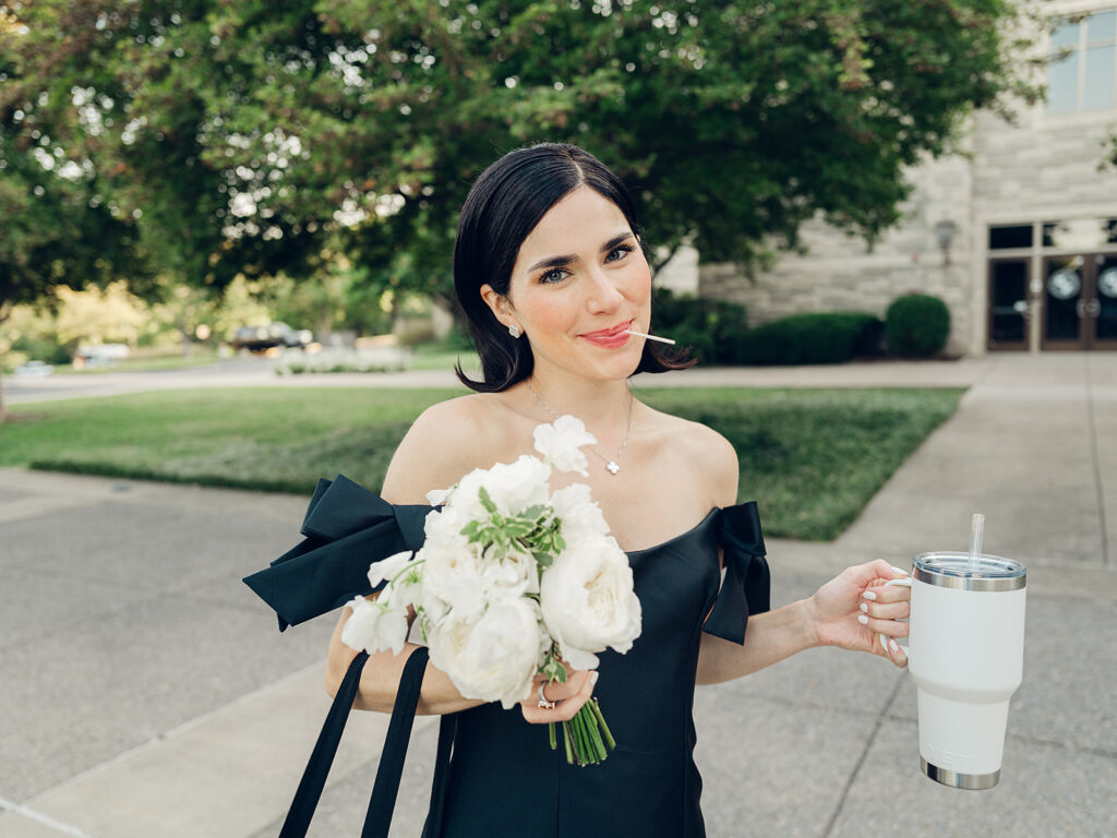 Romantic, editorial bridal bouquet featuring all-white garden roses, cloud roses, sweet peas, spray roses, ranunculus, and lisianthus accompanied by olive branches and light greenery. Soft and romantic bouquet to highlight elegance of a botanical tented wedding at Cheekwood. Design by Rosemary & Finch Floral Design in Nashville, TN.
