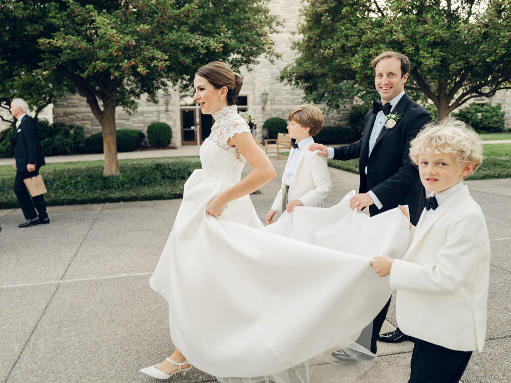 Romantic, editorial bridal bouquet featuring all-white garden roses, cloud roses, sweet peas, spray roses, ranunculus, and lisianthus accompanied by olive branches and light greenery. Soft and romantic bouquet to highlight elegance of a botanical tented wedding at Cheekwood. Design by Rosemary & Finch Floral Design in Nashville, TN.