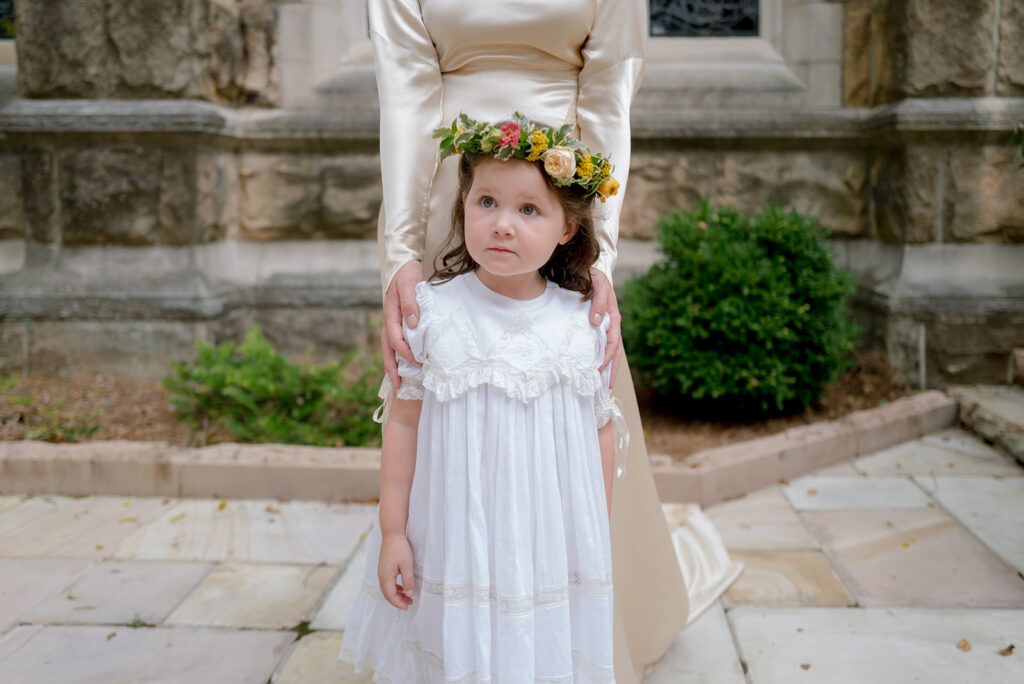 Colorful and bright bridesmaid bouquets for Sewanee wedding consisting of white calla lilies, apricot lisianthus, peach tulips, yellow butterfly ranunculus, yellow oncidium orchids and ranunculus in shades of orange, yellow and peach. Flower girl crowns match the same design as the bridesmaid bouquets. Fun, yet simple arrangements for a late summer wedding. Design by Rosemary and Finch Floral Design in Nashville, TN. 