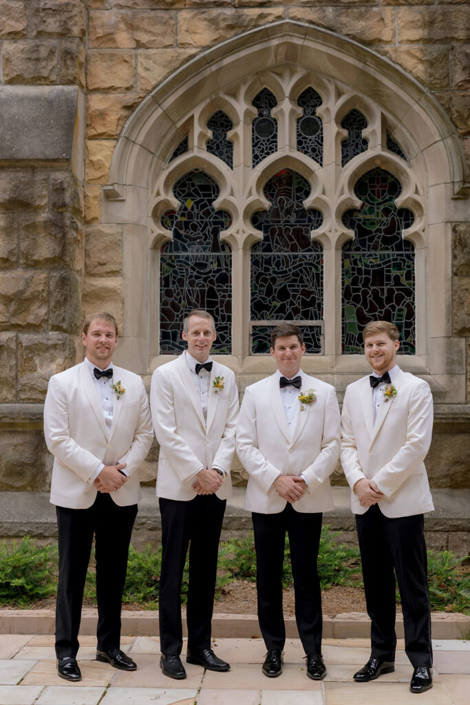 Colorful and bright bridesmaid bouquets for Sewanee wedding consisting of white calla lilies, apricot lisianthus, peach tulips, yellow butterfly ranunculus, yellow oncidium orchids and ranunculus in shades of orange, yellow and peach. Flower girl crowns match the same design as the bridesmaid bouquets. Fun, yet simple arrangements for a late summer wedding. Design by Rosemary and Finch Floral Design in Nashville, TN. 