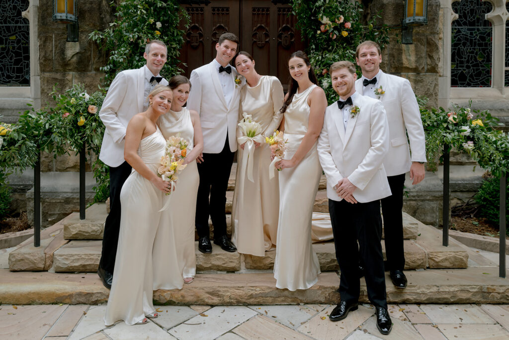 Colorful and bright bridesmaid bouquets for Sewanee wedding consisting of white calla lilies, apricot lisianthus, peach tulips, yellow butterfly ranunculus, yellow oncidium orchids and ranunculus in shades of orange, yellow and peach. Flower girl crowns match the same design as the bridesmaid bouquets. Fun, yet simple arrangements for a late summer wedding. Design by Rosemary and Finch Floral Design in Nashville, TN. 