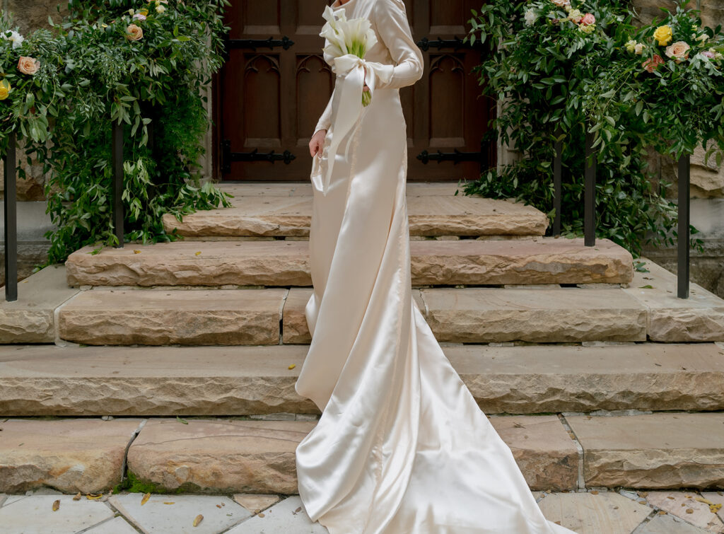 A simple and modest bouquet consisting of all white calla lilies wrapped in ivory silk. An elegant and classic touch to a beautiful summer wedding in Sewanee, TN. Design by Rosemary and Finch Floral Design in Nashville, TN. 