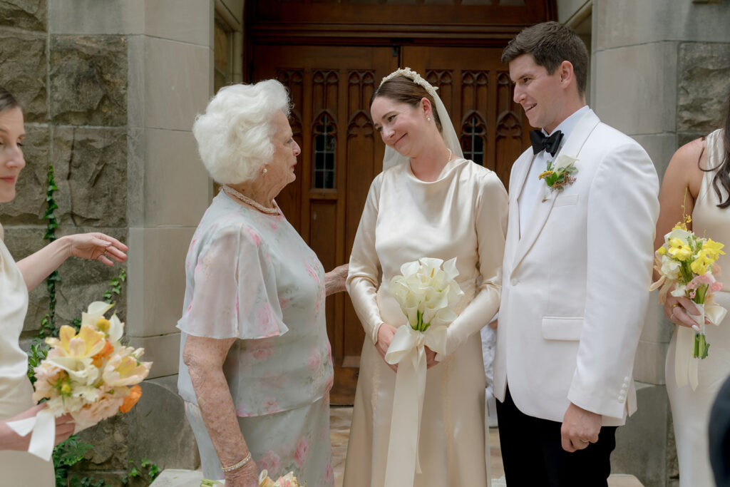 Colorful and bright bridesmaid bouquets for Sewanee wedding consisting of white calla lilies, apricot lisianthus, peach tulips, yellow butterfly ranunculus, yellow oncidium orchids and ranunculus in shades of orange, yellow and peach. Flower girl crowns match the same design as the bridesmaid bouquets. Fun, yet simple arrangements for a late summer wedding. Design by Rosemary and Finch Floral Design in Nashville, TN. 